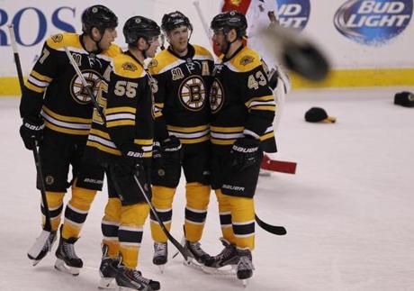 Bruins players celebrated the third goal of the night by David Krejci, third from left.
