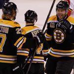 David Krejci is at the center of the celebration with Dougie Hamilton and Jarome Iginla after Krejci scored the first of his three goals of the night.