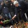 Secretary of State John F. Kerry placed flowers atamemorial to antigovernment protesters killed in Kiev last month.