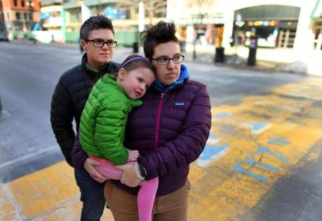 “I’m mostly afraid of being afraid,” said Casey Carey-Brown (right) of Jamaica Plain, with wife Michelle and daughter Riley.
