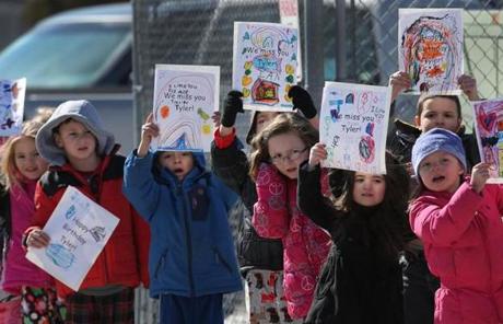 Well-wishers held signs at the Austin T. Levy Elementary School for their classmate, Tyler Seddon,
