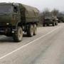 A convoy of military vehicles bearing no license plates traveled on the road from Feodosia to Simferopolin Crimea. 