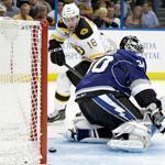 Reilly Smith slips a pretty goal by Ben Bishop to win it for the Bruins in the seventh round of a shootout.