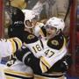 Reilly Smith (18) celebrated with teammate Torey Krug after Krug scored against the Panthers in the third period.