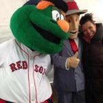 Red Sox mascot “Wally the Green Monster” posed with MBTA mascot “Charlie.”