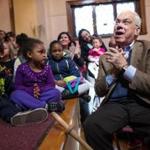 Thomas M. Menino sat with a group of children at a book signing at Dorchester Winter Farmers Market in Codman Square.