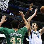 Avery Bradley and Kris Humphries tried to block a shot by Dirk Nowitzki in the first half.
