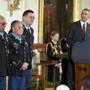 President Obama awarded the Medal of Honor to 24 recipients, including three living awardees. They are, from left, Army Staff Sgt. Melvin Morris, Army Sgt. 1st Class Jose Rodela, and Army Spc. Santiago Erevia.