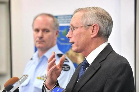 Air Commodore John McGarry (left) listened to John Young, Australian Maritime Safety Authority emergency response general manager, speak during a news conference on Thursday in Canberra, Australia. 
