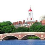 John W. Weeks Bridge and clock tower over Charles River in Harvard University campus.