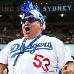 A Los Angeles Dodgers fan screams from the stands during the opening game of the Major League Baseball season between the Dodgers and the Arizona Diamondbacks, played Saturday in Sydney.
