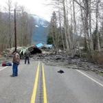 Emergency workers responded to the scene of the mudslide in Oso, Wash.