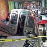 A Chicago Transit Authority train car rests on an escalator at the O'Hare Airport station after it derailed early on Monday.