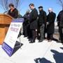  The Rev. Liz Walker opened the gun buyback news conference Monday with a prayer at Dr. Loesch Family Park in Dorchester. Mayor Martin J. Walsh of Boston was to her left.