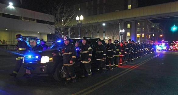 Firefighters escorted the body of a fallen colleague from Boston Medical Center to the Medical Examiner's Office nearby.