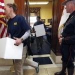 FBI investigators left the State House office of Gordon Fox with boxes of evidence last week.
