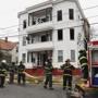 Firefighters mopped up at the scene of a three alarm fire on Henry Avenue in Lynn.