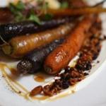 Whole grilled carrots are served with yogurt, honey, and a mixture of pistachios and other seeds at Alden & Harlow.