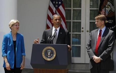 In 2011, President Obama named Richard Cordray (right) head of the Consumer Financial Protection Bureau. Elizabeth Warren wrote about the formation of the agency in her book.
