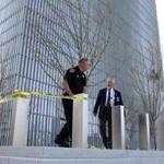 A Salt Lake City police officer put tape up as US Marshals investigated a shooting inside the Federal Courthouse.