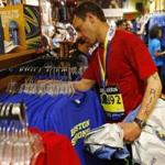 Rick Ginsberg of Denver checked out some Boston Strong T-shirts at Marathon Sports after running the Marathon on Monday.