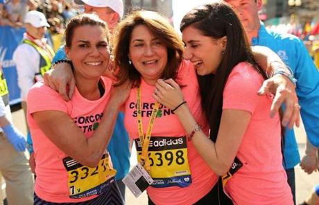 Celeste Corcoran, who lost two legs, crossed the line with daughter Sydney (right) and Celeste’s sister Carmen Acabbo.
