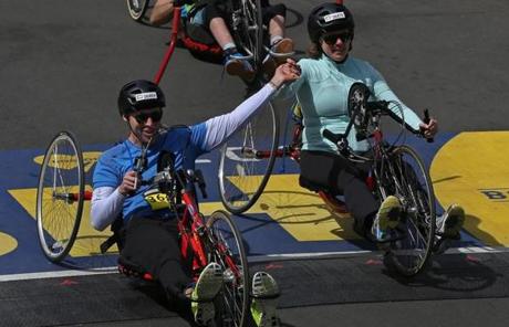 Patrick Downes and Jessica Kensky, who each lost a leg, cycled the Marathon route.
