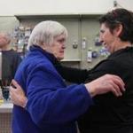 Longtime customer Eileen Carr (left) gave an emotional hug to Ann Marie O’Brien of Hamilton Hardware.