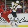 Luke Glendening seems to get the worst of this collision with Bruins defenseman Kevan Miller.  Rick Osentoski/USA Today