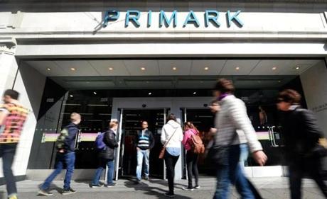  Pedestrians walk past a Primark store in central London, 23 April, 2014. Primark is to open its first stores in America, beginning with clothing store in Boston, Massachusetts, the clothing retailer announced 23 April.
