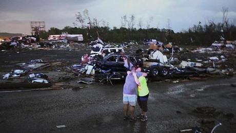 Lori Berseth (right) is consoled after seaching for her missing dog, Lucille, after a tornado destroyed the town of Mayflower, Arkansas.
