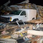 A damaged vehicle is seen amid debris after a tornado hit the town of Mayflower, Arkansas Sunday night.