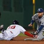 Shane Victorino is tagged out by Tampa’s Ben Zobrist trying for a double in Tuesday night’s game. Jim Davis/Globe Staff