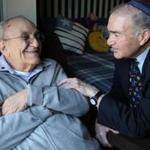Alan Zuker, who is receiving hospice care and other services at Hebrew SeniorLife in Dedham, is greeted by Rabbi Herman Blumberg.
