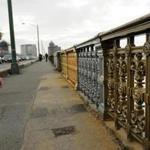 A team of local and state officials are testing out paint colors on Longfellow Bridge to determine which tints exactly match the original colors of the century-old structure.