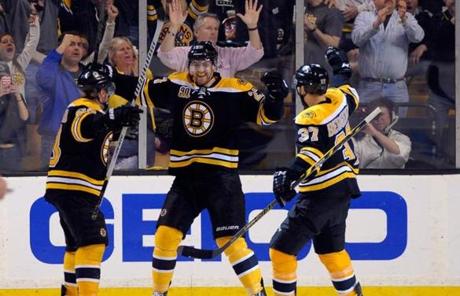 Dougie Hamilton celebrated his goal in the third with Brad Marchand and Patrice Bergeron.
