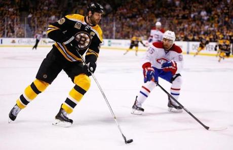 Zdeno Chara handled the puck in front of Francis Bouillon.
