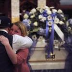 Jose Oliver, the father of Jeremiah Oliver, received a comforting hug during the funeral services at Rollstone Congregational Church in Fitchburg.