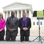 Rev. Dr. Rob Schenck, Raymond Moore, and Patty Bills of Faith and Action prayedin front of the Supreme Court during a news conference Monday.