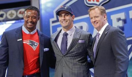Eastern Illinois quarterback Jimmy Garoppolo (center) posed with NFL Commissioner Roger Goodell (right) and former Patriots linebacker Willie McGinest after being selected by New England in the second round.
