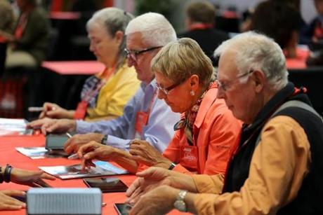 At the AARP convention in Boston this week, advisers helped participants navigate on tablets.
