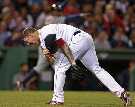 Jake Peavy takes off his hat and howls after Torii Hunter’s fifth-inning hit-and-run single.
