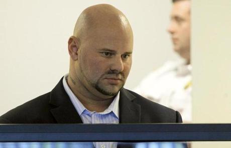 Jared Remy stood during an arraignment last October. 
