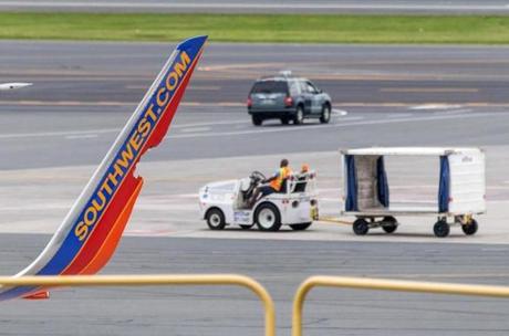Damage to the left wing of a Southwest aircraft would be seen at Logan on Monday.
