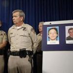 Las Vegas Sheriff Doug Gillespie (right) displayed photos of the shooting suspects at a news conference Monday.