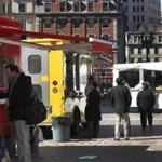 Food trucks line up on Dewey Square near South Station in Boston.