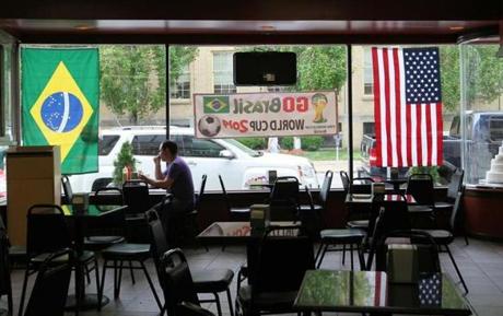  A lone customer sat Tuesday at the Padaria Brasil Bakery in Framingham, where tables may soon be filled with Brazilian natives celebrating if their home country wins its first-round match against Croatia on Thursday.
