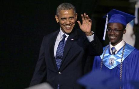 President Obama, followed by student body President Reginald Sarpong, waved to students at the commencement.
