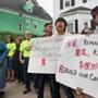 Residents, tenants and housing activists staged a rally outside a foreclosed home on Norwell Street in Dorchester on Tuesday. The home is is now owned by Fannie Mae. 
