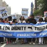 Low-wage workers from multiple industries marched in downtown Boston to draw attention to the fight for higher pay.